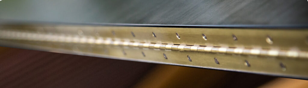 Continuous hinge on a door Continuous hinge on a door